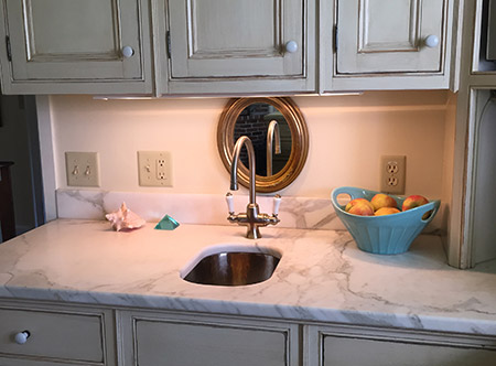 After the KonMari Method, my kitchen counter is clutter-free, with 3 decorative accents placed on the counter for mood. You can spread out your hands and feel the clean marble counter space!