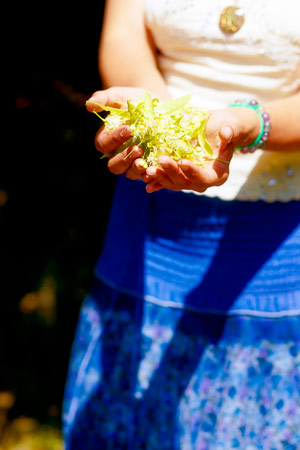 a woman holding flower essences